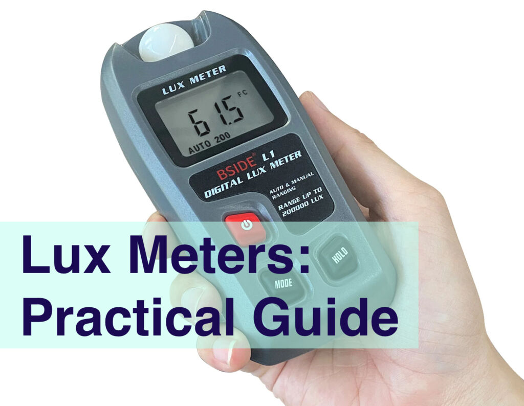 Close-up of a hand holding a digital lux meter."