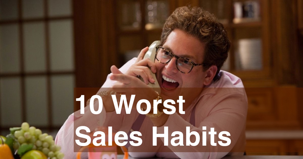 10 Worst Sales Habits Actor portraying a salesperson in a high-energy phone conversation in an office setting, reminiscent of a scene from 'The Wolf of Wall Street'.